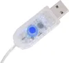A close-up of a USB connector with a blue button and internal circuitry, against a white background. Náhled obrázku produktu