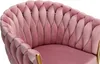 Close-up of a pink velvet armchair with gold accents. Produktbild-Vorschau