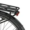 A close-up view of the rear wheel, fender, and rear rack of a black electric bicycle. Produktbild-Vorschau