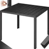 A close-up view of a black aluminum garden table.