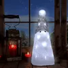 A festive Christmas decoration scene with a lit Santa Claus figure, candles, and a lantern on a wooden surface, set against a snowy window view. Produktbild-Vorschau