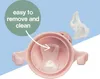 Close-up view of a pink sippy cup lid with a removable spout, highlighting ease of cleaning. Produktbild-Vorschau