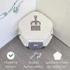 A white corner cat litter box with a lid is placed in the corner of a room, with graphics and text overlays on the floor. Produktbild-Vorschau