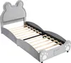 A child's bed with a bear-shaped headboard and paw print details on the footboard, shown from a diagonal angle against a white background. Produktbild-Vorschau