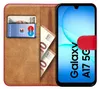 A book-style phone case with a Samsung Galaxy A17 5G phone inside, showing a credit card and euro banknotes in the wallet section. Produktbild-Vorschau