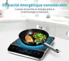 An induction cooktop with a frying pan containing food. Anteprima dell’immagine prodotto