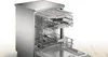A stainless steel dishwasher with its racks pulled out. Voir les images du produit