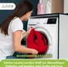 A woman is putting a red garment into a washing machine. Produktbild-Vorschau