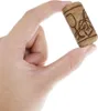 A hand holding a wine cork with a wine glass and grape vine design. Anteprima dell’immagine prodotto
