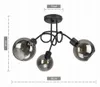 A black ceiling light with three smoked glass globes and decorative metal arms, shown against a white background with dimensions indicated. Produktbild-Vorschau