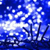 A close-up shot of blue LED string lights with a bokeh background. Voir les images du produit