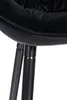 Close-up view of the base of a black upholstered chair, showing the connection of the seat to the metal legs. Podgląd zdjęcia produktu
