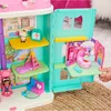 A child's hand is shown interacting with a colorful toy dollhouse. Náhľad obrázku produktu