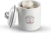 A white ceramic garlic keeper with a lid, filled with garlic bulbs, placed on a white background. Produktbild-Vorschau