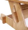 A close-up view of a wooden laptop stand, showing its adjustable mechanism and storage compartments. Produktbild-Vorschau