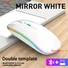 A white wireless mouse with rainbow LED lighting is placed on a laptop keyboard. Produktbild-Vorschau