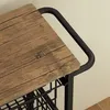 A close-up view of a wooden countertop and black metal frame of a kitchen cart. Podgląd zdjęcia produktu