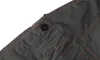A close-up view of a dark gray garment, likely trousers or overalls, showing a black button and orange stitching. Produktbild-Vorschau