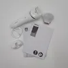 A white Philips epilator and its accessories are laid out on a white surface, along with instruction manuals. Náhled obrázku produktu