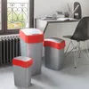 Three trash cans of different sizes are placed on a carpeted floor next to a radiator and a window. A desk with office supplies and a chair are visible in the background. Podgląd zdjęcia produktu