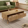 A living room scene with a green sofa, a wooden coffee table with open drawers, and a cat sleeping in a bed on the rug. Produktbild-Vorschau