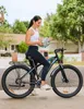 A woman is holding a helmet next to an electric bicycle in a suburban setting. Produktbild-Vorschau