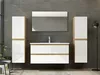 A modern bathroom vanity set with two tall cabinets, a vanity unit with drawers, and a mirror, set against a textured gray wall. Produktbild-Vorschau