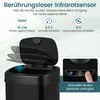 A black sensor trash can with its lid open, showing internal features and marketing text highlighting its capabilities. Podgląd zdjęcia produktu