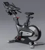 A studio shot of a black and silver exercise bike against a plain gray background. Náhled obrázku produktu