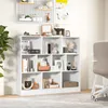 A white bookshelf filled with books and decorative items in a room. Náhľad obrázku produktu