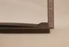 A close-up side view of a cast iron grate with a ruler next to it. Náhled obrázku produktu