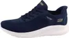 A side view of a navy blue Skechers Slip-Ins sneaker with a white sole. Produktbild-Vorschau