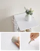 Collage of images showing a white shelf unit with hooks and storage, with close-ups of its material being cleaned and a key touching it. Náhled obrázku produktu