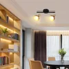 A modern living room with a bookshelf and a dining area. Voir les images du produit