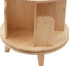 A close-up view of a wooden rotating bookshelf with four compartments. Náhled obrázku produktu