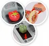 Collage showing close-ups of a toy cash register with accessories like a tomato, bell pepper, and ice cream container. Produktbild-Vorschau