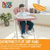 A young child sits in a pink high chair in a well-lit room. Produktbild-Vorschau