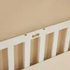 A close-up view of the white wooden frame of a child's bed, showing the connection hardware. Náhľad obrázku produktu