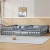 A grey wooden floor bed with two mattresses and bedding, set up in a room with a light-colored wall and a framed picture. Anteprima dell’immagine prodotto