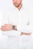 A man wearing a white shirt and a watch. Produktbild-Vorschau