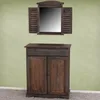 A wooden cabinet with a mirror above it, set against a textured green wall and a gray carpet. Náhľad obrázku produktu