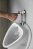 A hand is pressing the flush button on a urinal. Anteprima dell’immagine prodotto