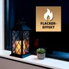 A black lantern with a lit LED candle inside sits on a white windowsill next to a small potted succulent. The background is a dark window reflecting the scene. Produktbild-Vorschau