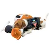 A dog wearing a tactical vest lies with plush toys. Produktbild-Vorschau