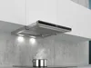 A modern kitchen with a stainless steel range hood installed above a stovetop. Voir les images du produit