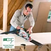 A man is using a circular saw with a guide rail and vacuum attachment in an attic or workshop. Podgląd zdjęcia produktu