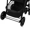 A close-up view of the wheels and storage basket of a black stroller. Podgląd zdjęcia produktu