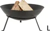 A black metal fire bowl with logs inside, resting on three legs. Produktbild-Vorschau