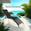 A black lounge chair is placed on a patio next to an infinity pool with a tropical ocean view. Náhled obrázku produktu