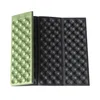 Two folded camping mats, one green and one black, are shown against a white background. Produktbild-Vorschau